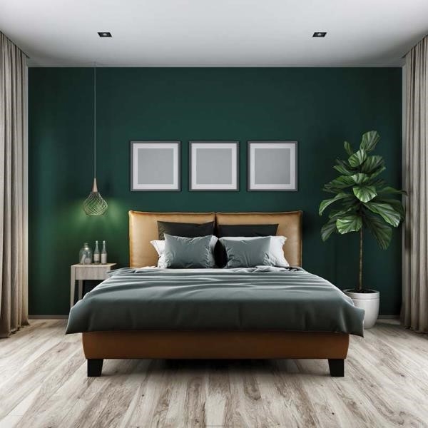Phòng ngủ được trang trí bằng màu xanh ngọc bích kết hợp với màu than trung tính.